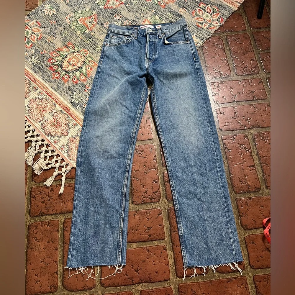 Re Done high rise stove pipe raw frayed hem denim jeans